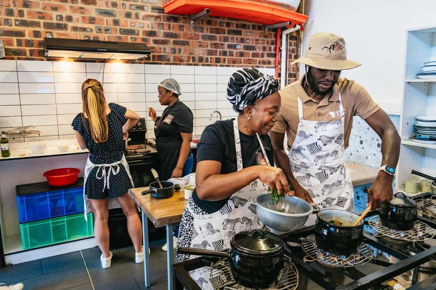 Cape Town: Authentic African Cuisine Cooking Experience - Building the meal: pap, stews, vegetables, and beans