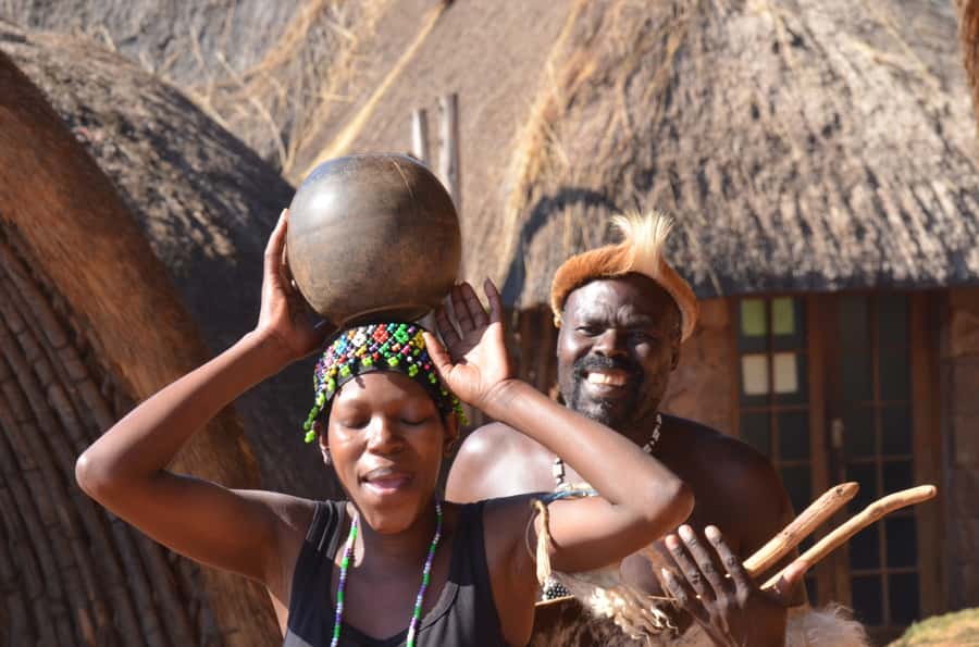 Durban: Phezulu Cultural Village & Reptile Park Tour - Entering the traditional Zulu huts