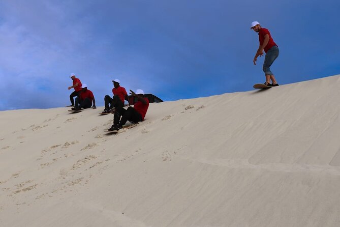 JEEP 4x4, Quadbike, and Glam Sandboarding Combo at Atlantis Dunes - Sandboarding down the steep slopes