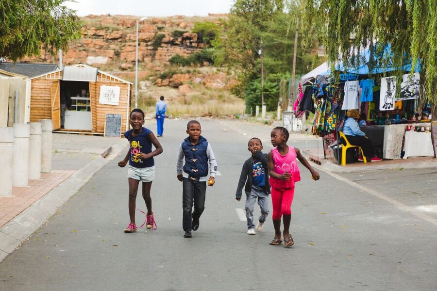 Johannesburg and Soweto Apartheid Full Day Tour w/Lunch - Entering Soweto with a guide