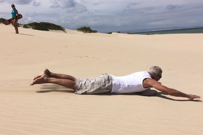 Sandboarding in Jeffreys Bay, South Africa - Sitting boards make the activity more welcoming