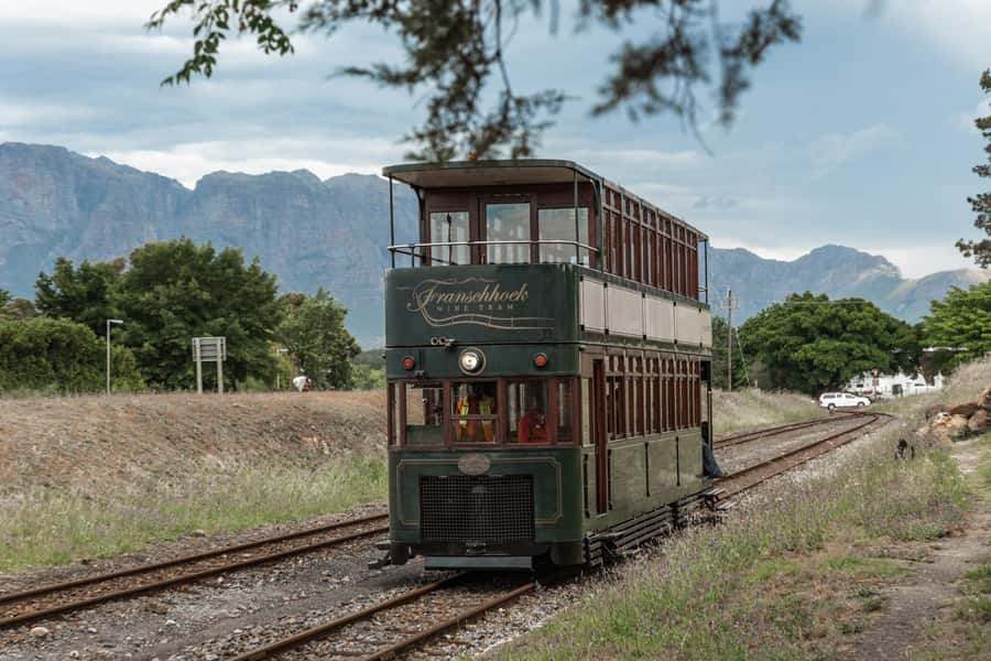 SCHEDULED FRANSCHHOEK WINE TRAM EXPERIENCE (by group size) - Leaving Cape Town For The Franschhoek Valley