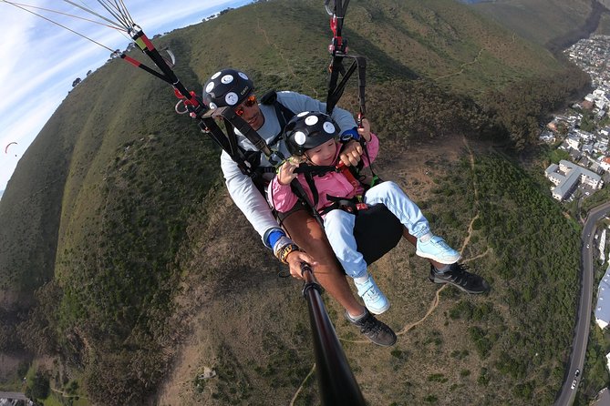 Tandem Paragliding in Cape Town - Landing near the ocean and returning to Signal Hill